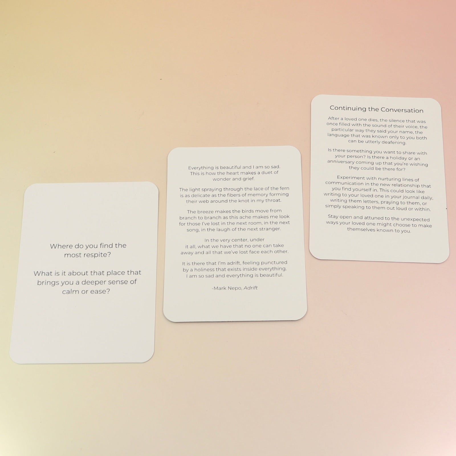 The contents of the Planet Grief Card Deck Bereavement Resource on a pink and yellow background.