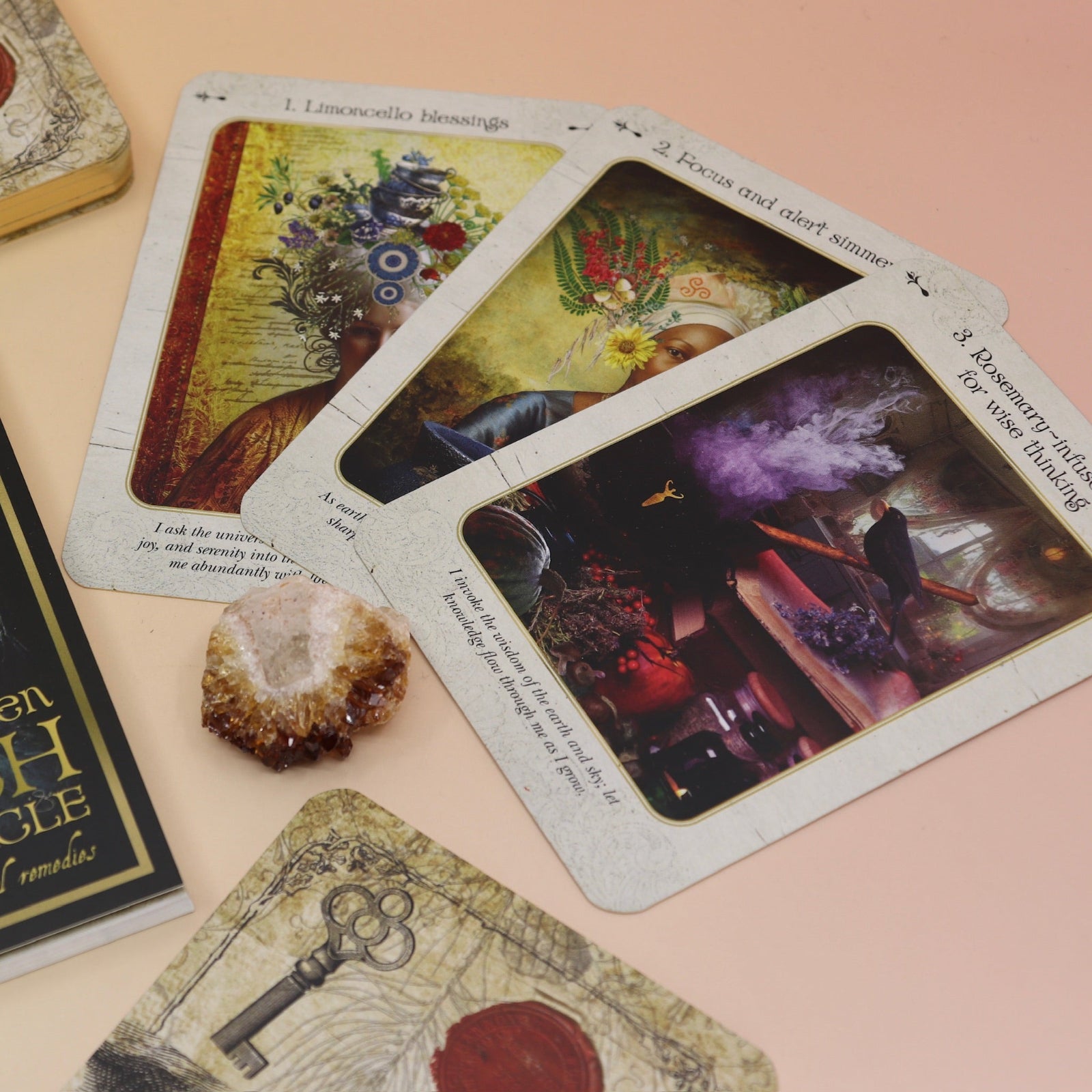 The contents of the Kitchen Witch Oracle Deck on a pink and yellow background.