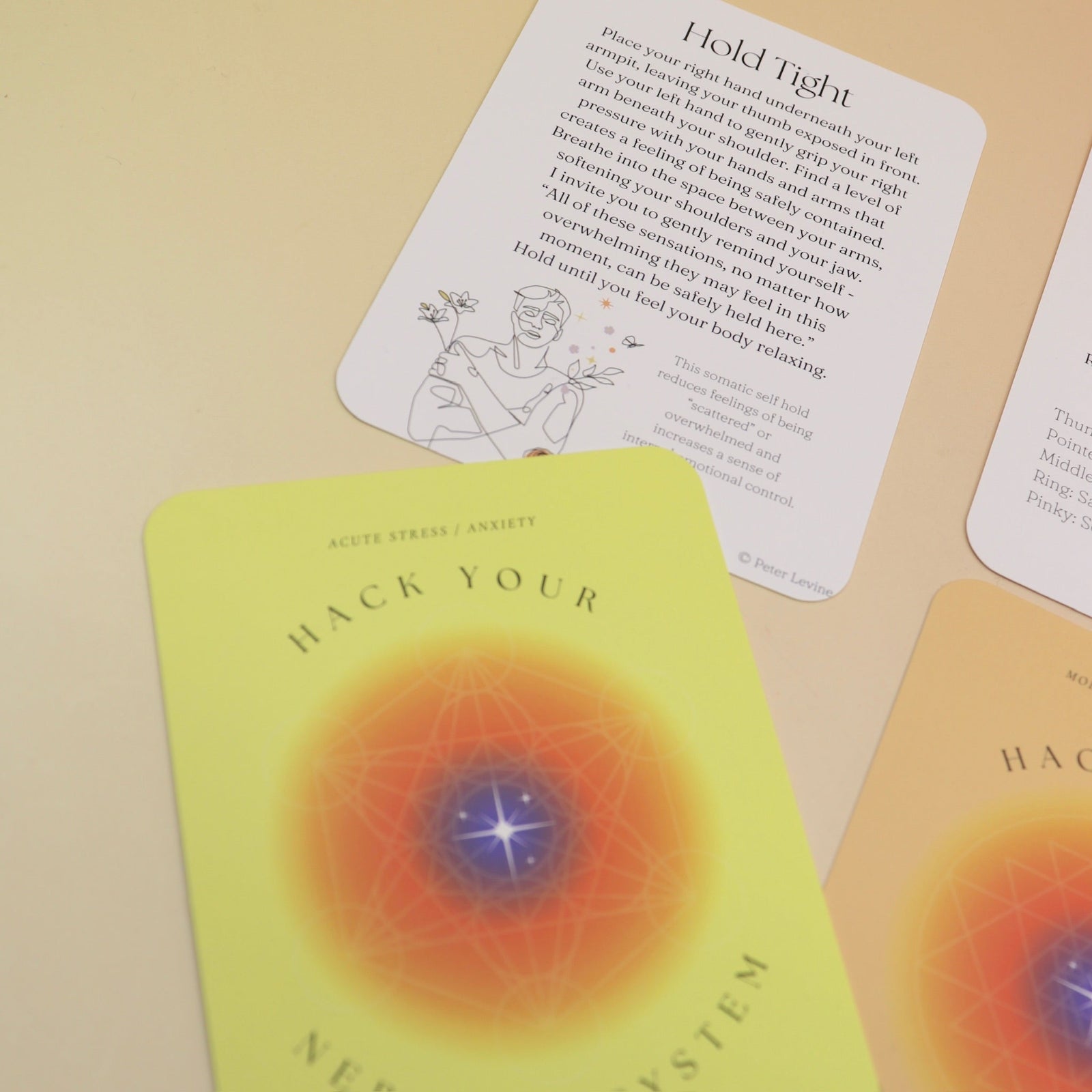 The contents of the Hack Your Nervous System card deck on a pink and yellow background.
