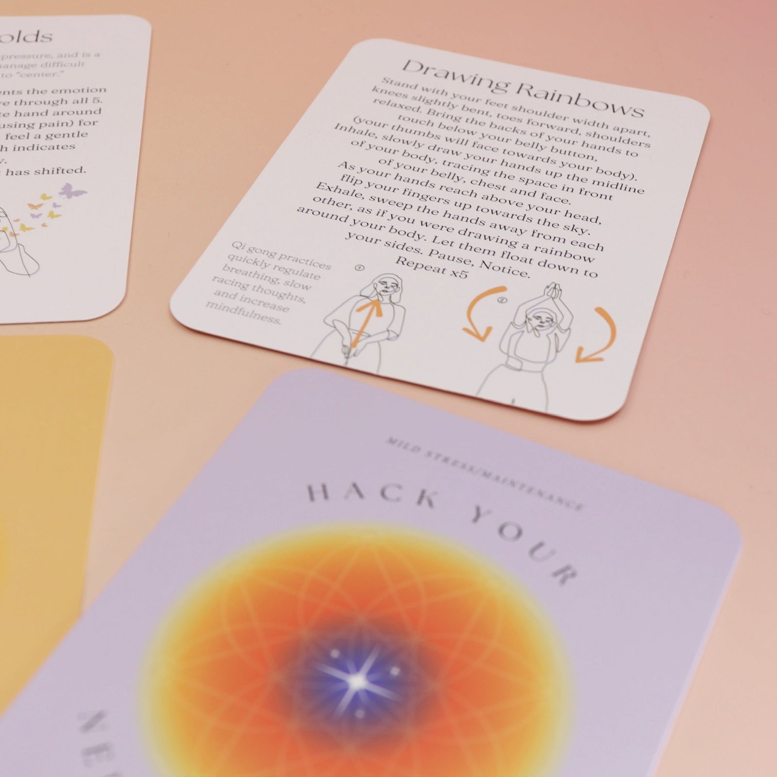 The contents of the Hack Your Nervous System card deck on a pink and yellow background.