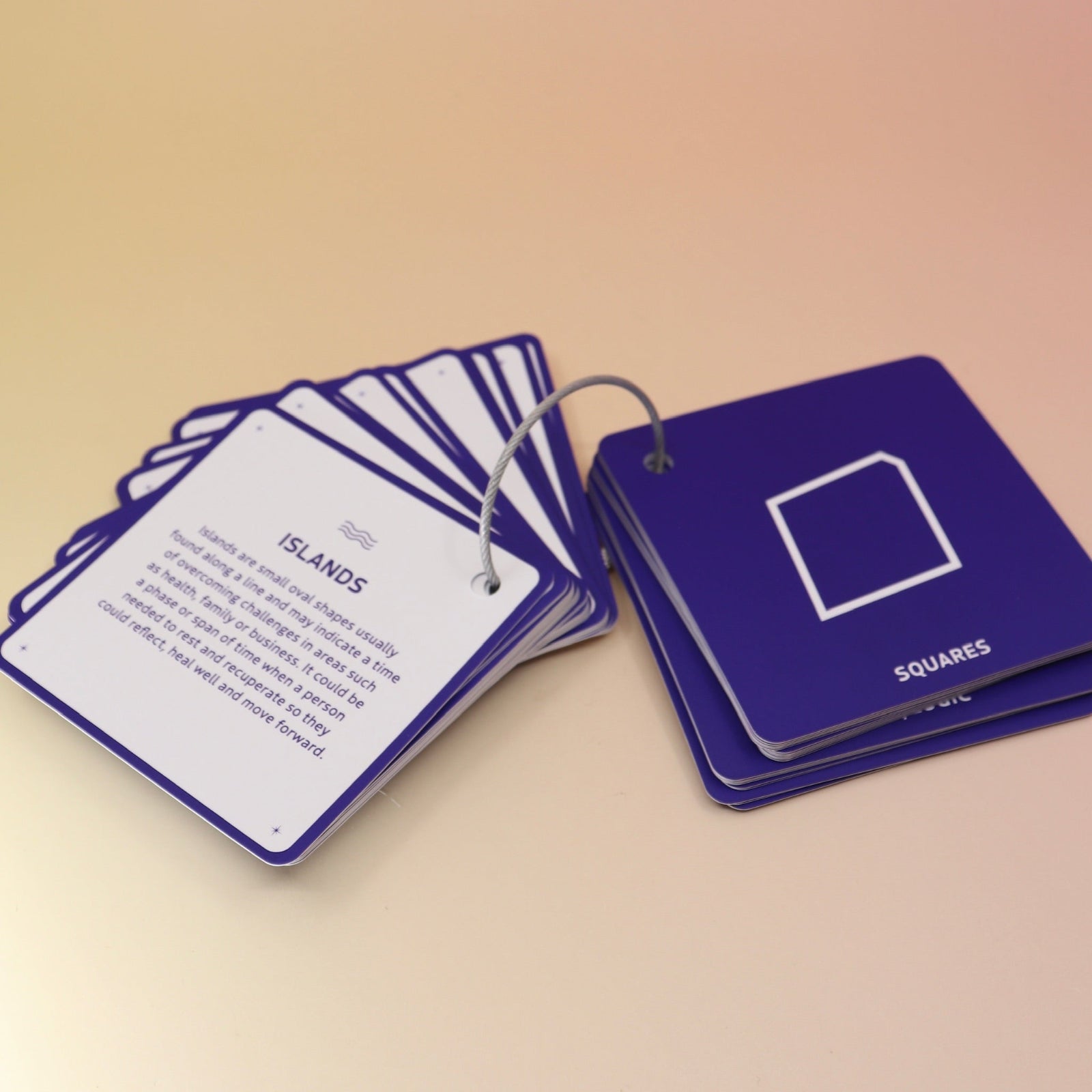 The flashcards from the Palmistry Flashcards by Anna Comerford on a pink and yellow background.