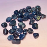 Collection of blue stones on a gradient background