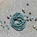 Larimar stone bracelet on a gray surface