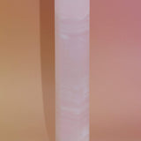 Crystal tower on a gradient pink background