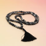 Net Jasper 108 Mala Necklace on pink and orange background