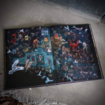 Open book with detailed illustrations on a concrete floor