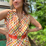 girl in 1970s Gingham Belted Romper in front of green VW vintage bus