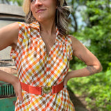 girl in 1970s Gingham Belted Romper in front of green VW vintage bus