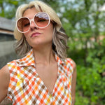 girl in 1970s Gingham Belted Romper in front of green VW vintage bus