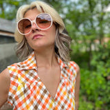 girl in 1970s Gingham Belted Romper in front of green VW vintage bus