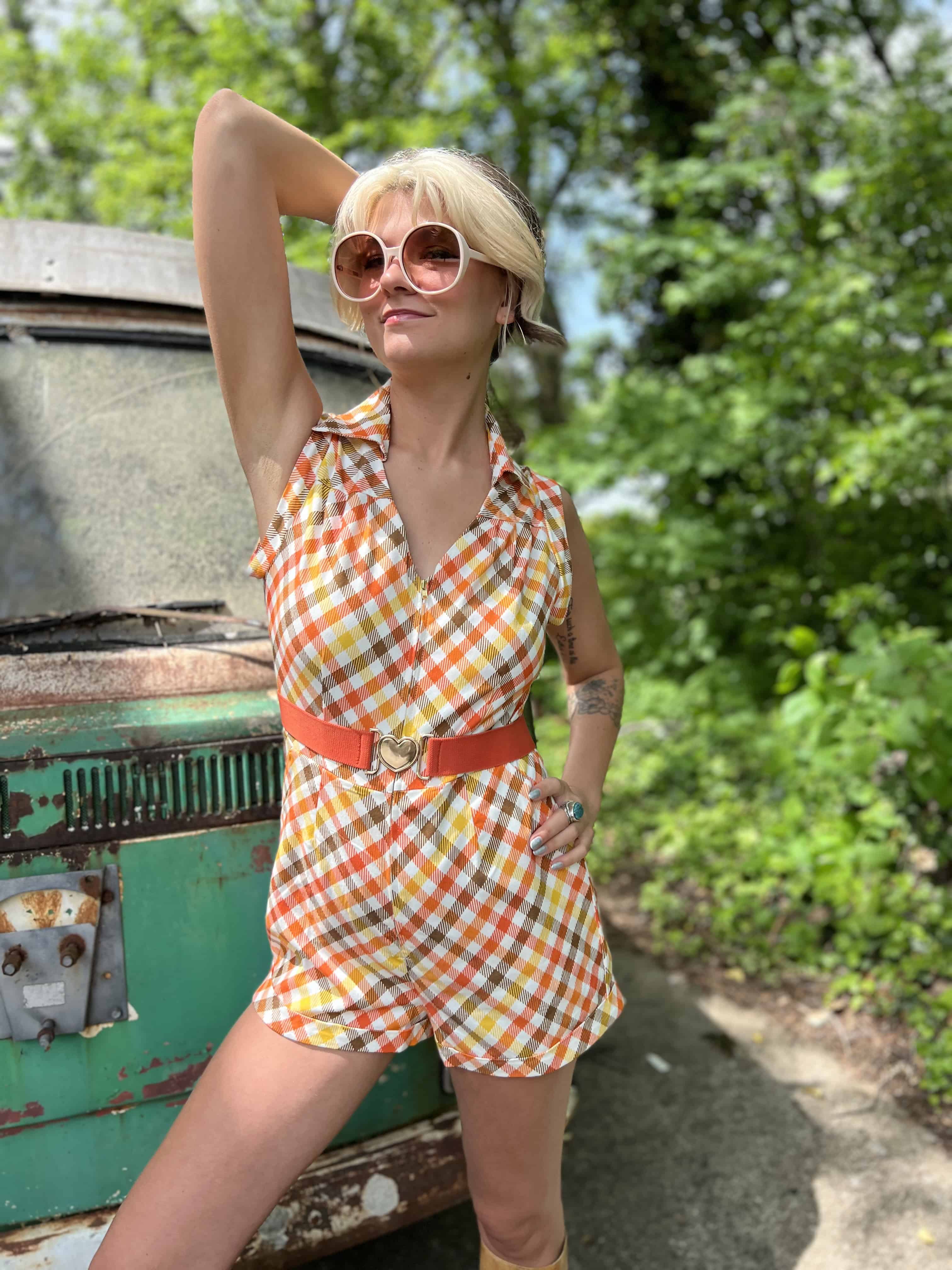 girl in 1970s Gingham Belted Romper in front of green VW vintage bus
