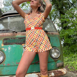 girl in 1970s Gingham Belted Romper in front of green VW vintage bus