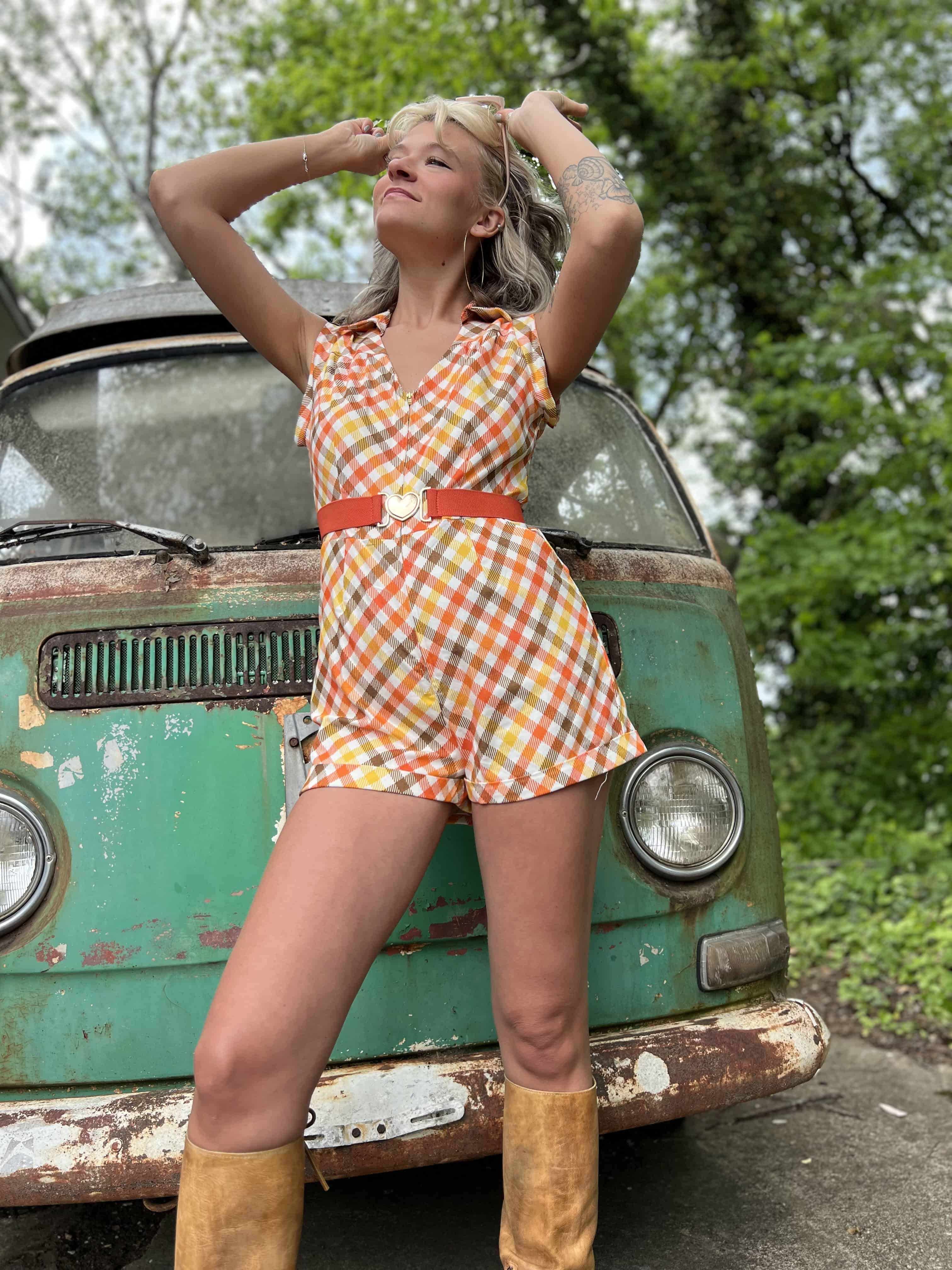 girl in 1970s Gingham Belted Romper in front of green VW vintage bus