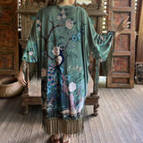 Someone wearing the 1930s Vintage Teal Peacock Fringe Kimono.