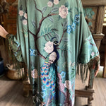 Someone wearing the 1930s Vintage Teal Peacock Fringe Kimono.