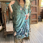 Someone wearing the 1930s Vintage Teal Peacock Fringe Kimono.
