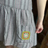 An up close image of the gray Granny Square Mini Skirt.