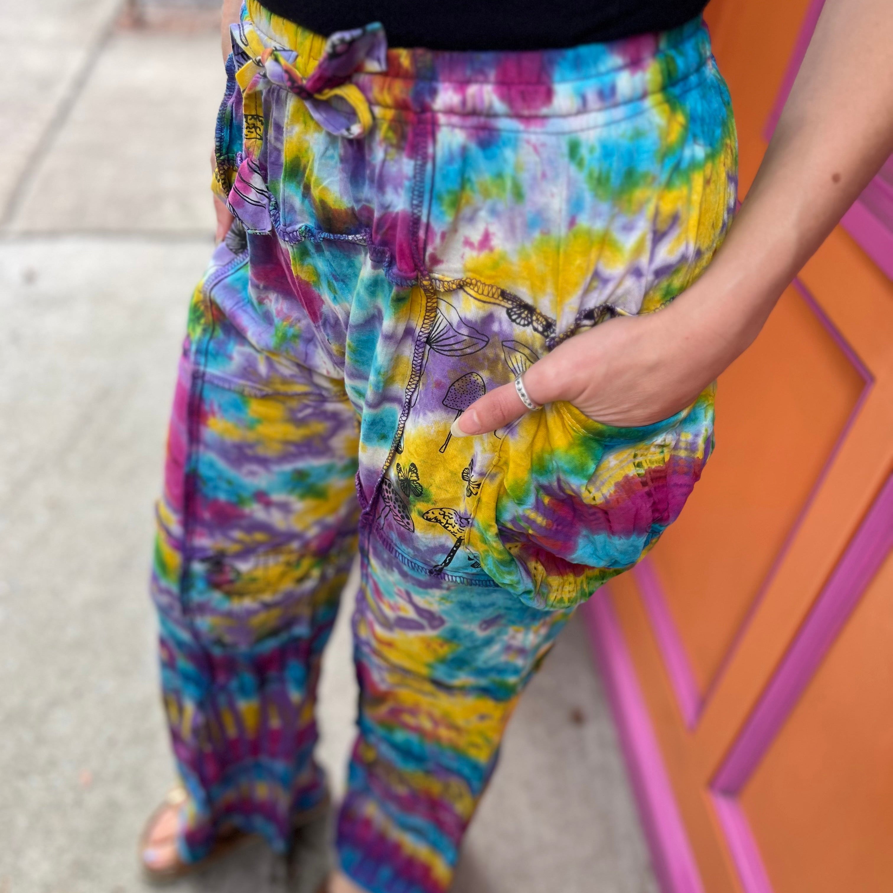 A woman wearing the Rainbow Tie Dye Pocket Bell Cotton Trouser.