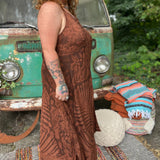 A woman wearing the amber gold Hippie Boho Maxi Flowy Tie Dye Dress in front of a vintage Volkswagen Bus.