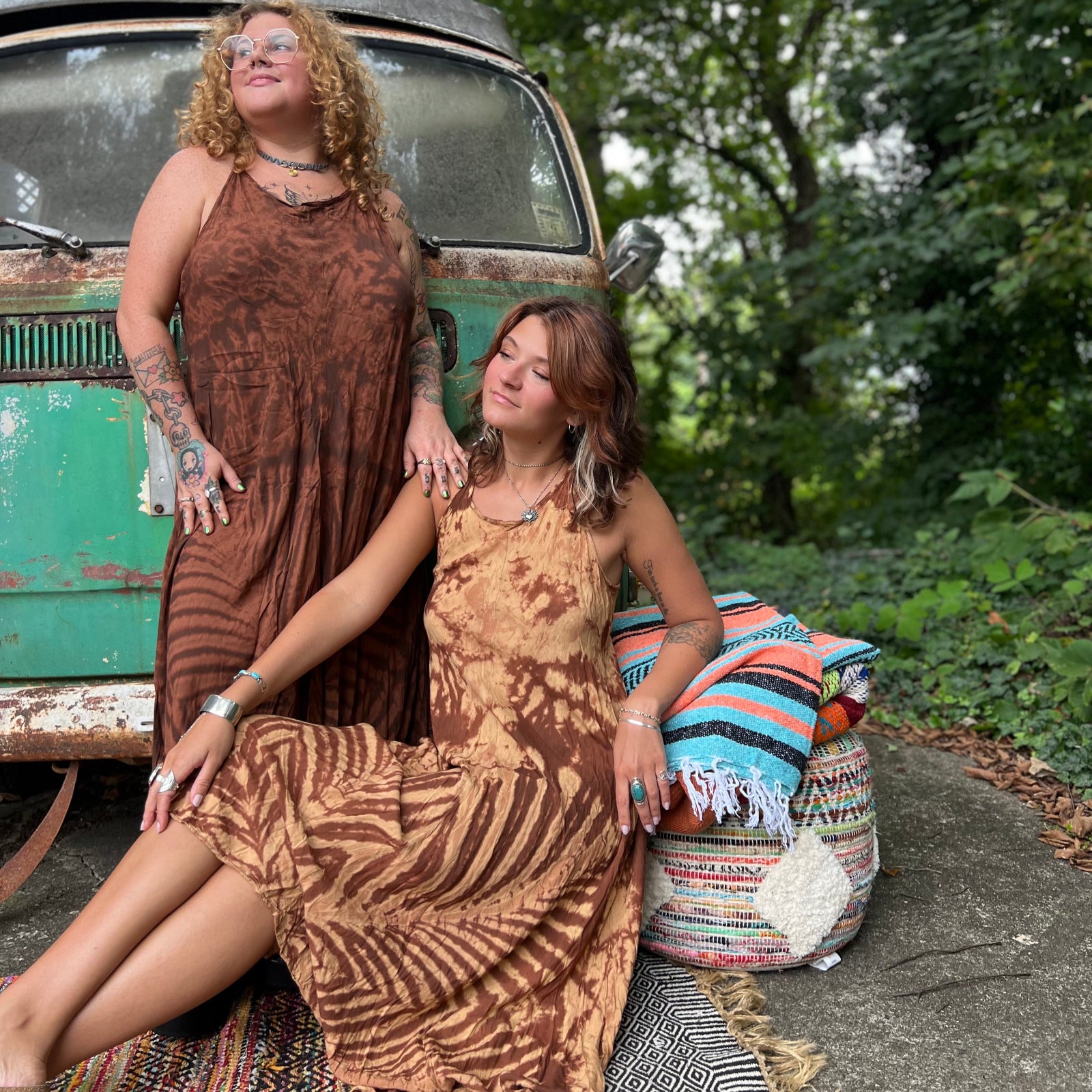 Two women wearing the amber gold Hippie Boho Maxi Flowy Tie Dye Dress in front of a vintage Volkswagen Bus.
