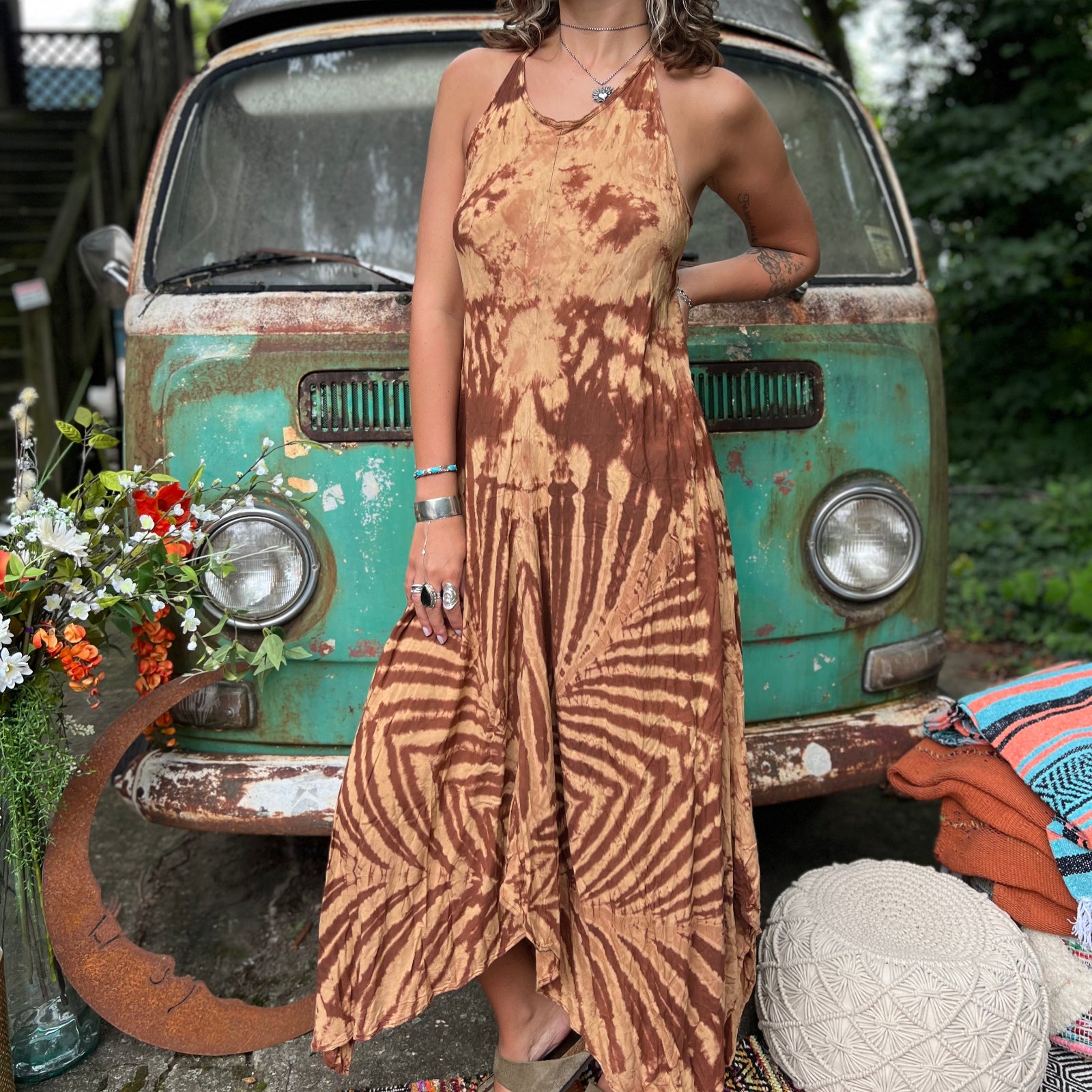 A woman wearing the amber gold Hippie Boho Maxi Flowy Tie Dye Dress in front of a vintage Volkswagen Bus.