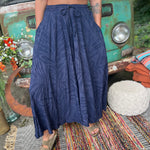 A woman wearing the navy Hippie Bohemian Hand Dyed Palazzo Pants in front of a vintage Volkswagen bus.