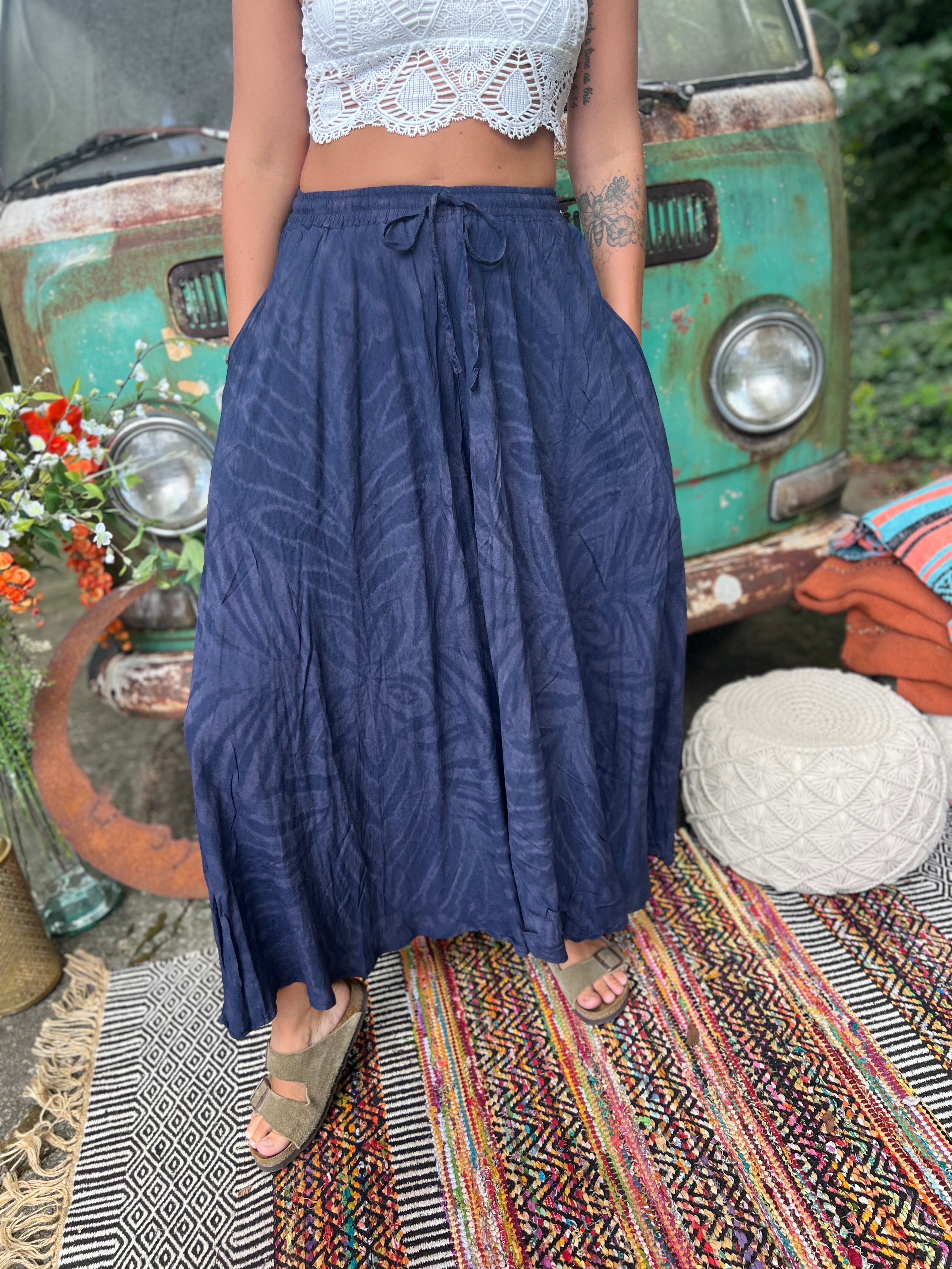 A woman wearing the navy Hippie Bohemian Hand Dyed Palazzo Pants in front of a vintage Volkswagen bus.