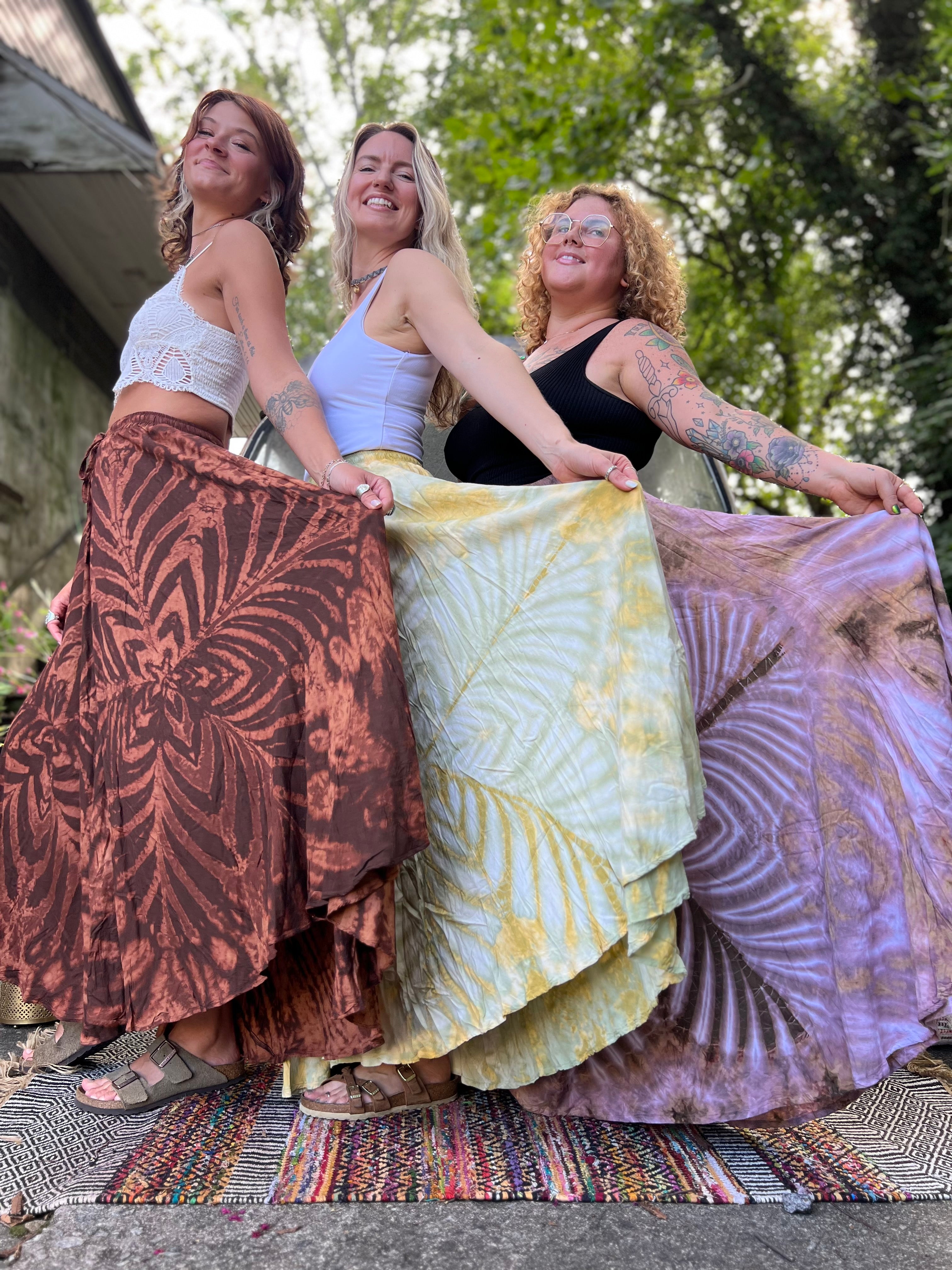 Three women wearing the different colors of the Hippie Bohemian Hand Dyed Palazzo Pants.