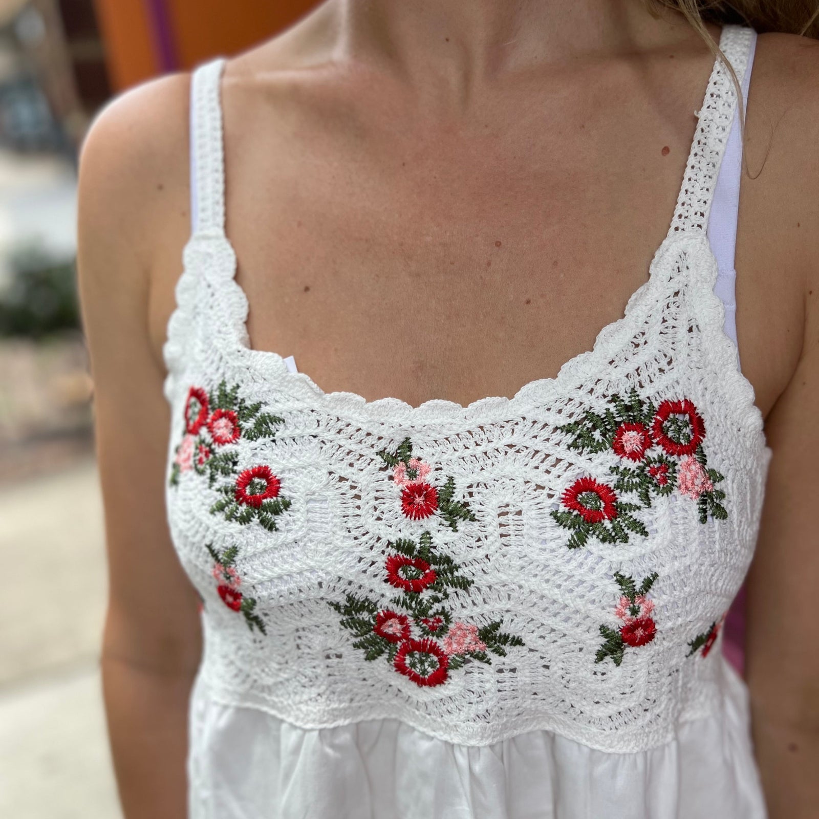 A woman wearing the Floral Crochet Lace Spaghetti Strap Dress.