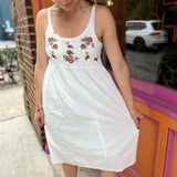 A woman wearing the Floral Crochet Lace Spaghetti Strap Dress.