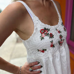 A woman wearing the Floral Crochet Lace Spaghetti Strap Dress.