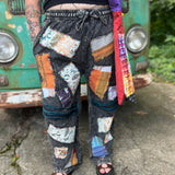 A woman wearing the Multi Patch Hippie Gypsy Cotton Trouser in front of a vintage Volkswagen bus.