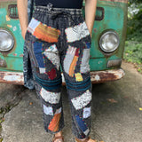 A woman wearing the Multi Patch Hippie Gypsy Cotton Trouser in front of a vintage Volkswagen bus.