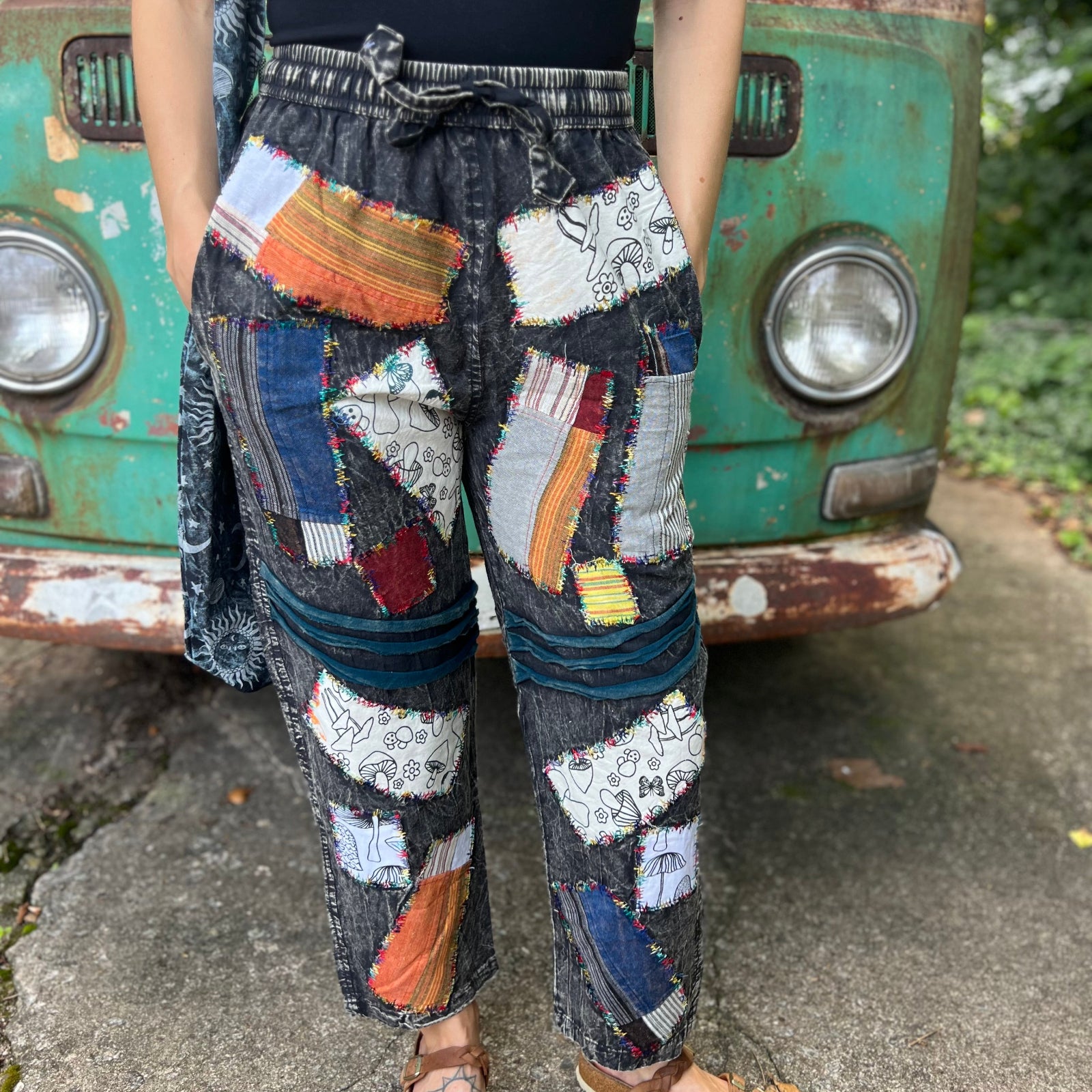 A woman wearing the Multi Patch Hippie Gypsy Cotton Trouser in front of a vintage Volkswagen bus.