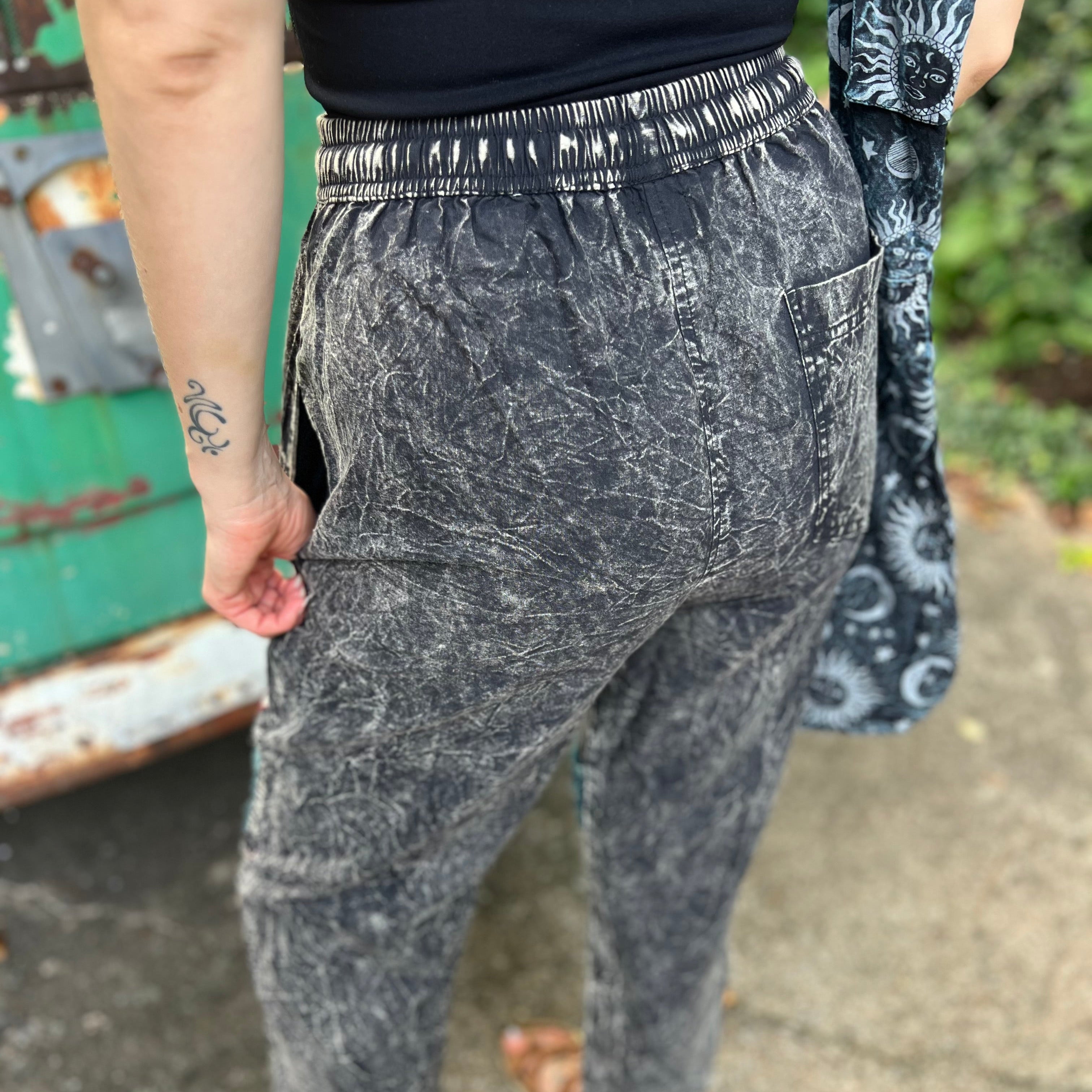 A woman wearing the Multi Patch Hippie Gypsy Cotton Trouser in front of a vintage Volkswagen bus.