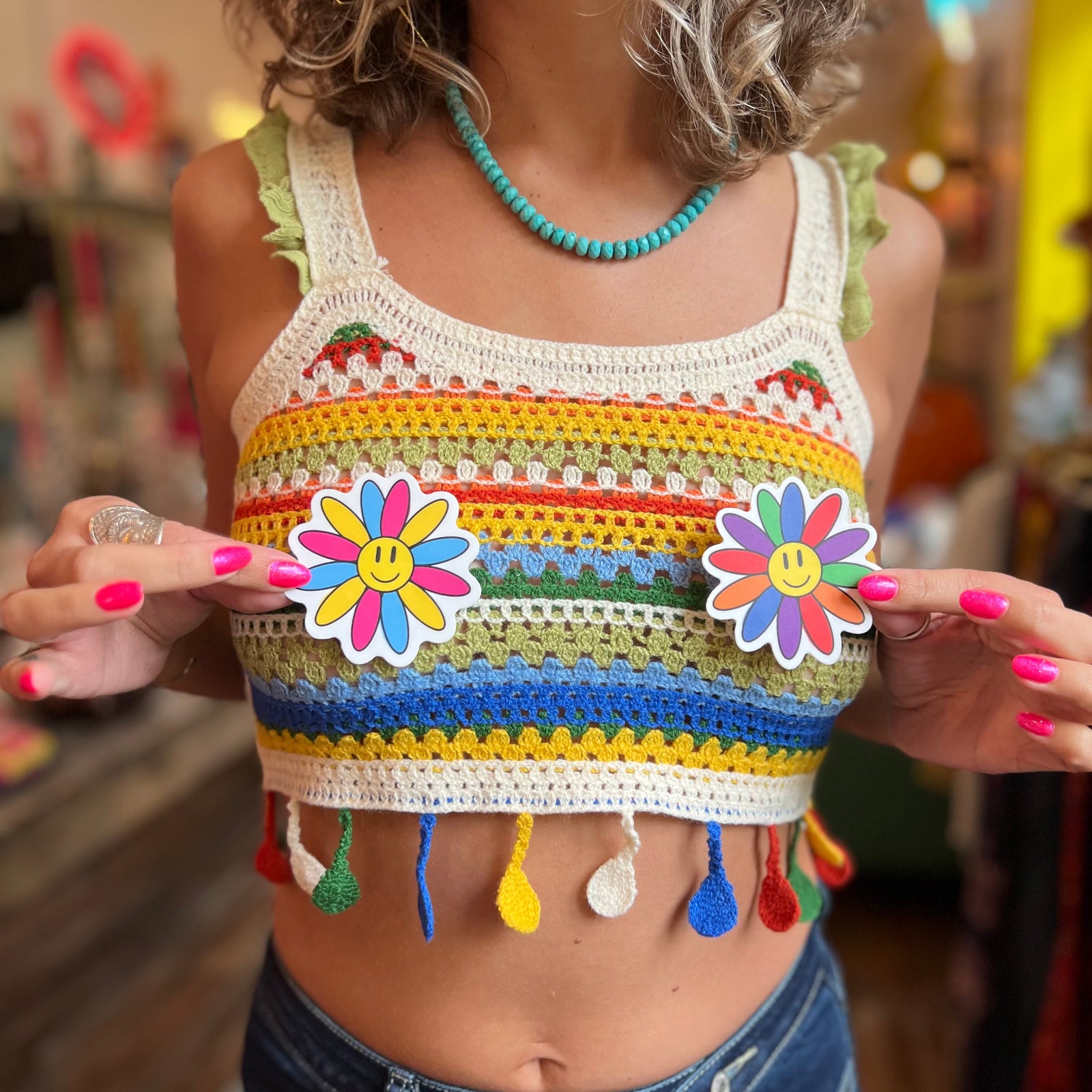 An up-close picture of someone wearing the beige Bohemian Style Colorful Striped Knit Tank Top.