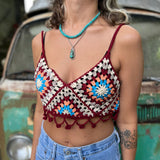 Someone wearing the Handmade Bohemian Crochet Design Cropped Camisole in front of an old teal Volkswagen bus.