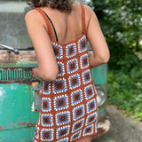 Someone wearing the coffee Sleeveless Knit Tank Dress in front of an old teal Volkswagen bus.