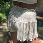 Someone wearing the Taupe Bandana Shorts with Elastic Waist.