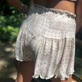 Someone wearing the Taupe Bandana Shorts with Elastic Waist.