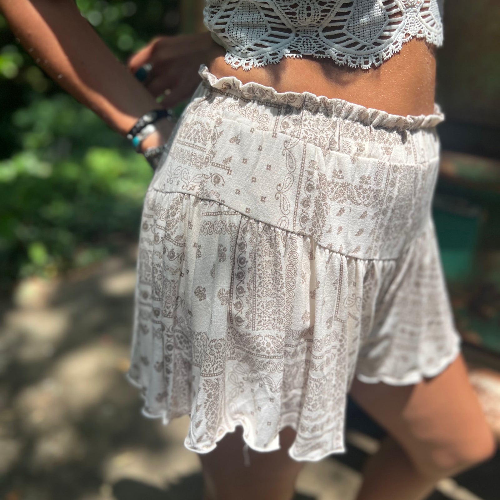 Someone wearing the Taupe Bandana Shorts with Elastic Waist.