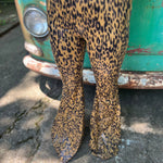 Someone wearing the Mustard Animal Print Bell Bottoms with Elastic Waist.