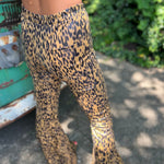 Someone wearing the Mustard Animal Print Bell Bottoms with Elastic Waist.