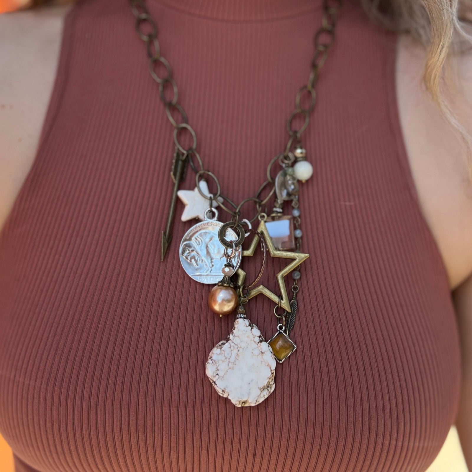 A woman wearing the Gypsy Junk Original Dutton 24" Necklace with a mauve tank.