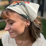Someone wearing the Tomato Ivory Cotton Bandana.
