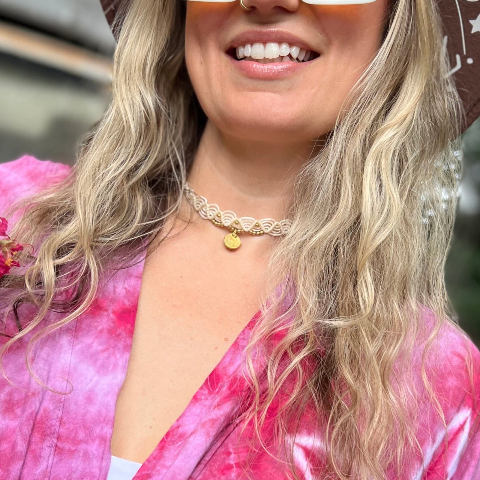 Someone wearing the cream Macrame Pendant Choker Necklace.