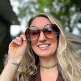 Someone wearing the juniper Bardot Seventies Round Sunglasses with a brown kimono.