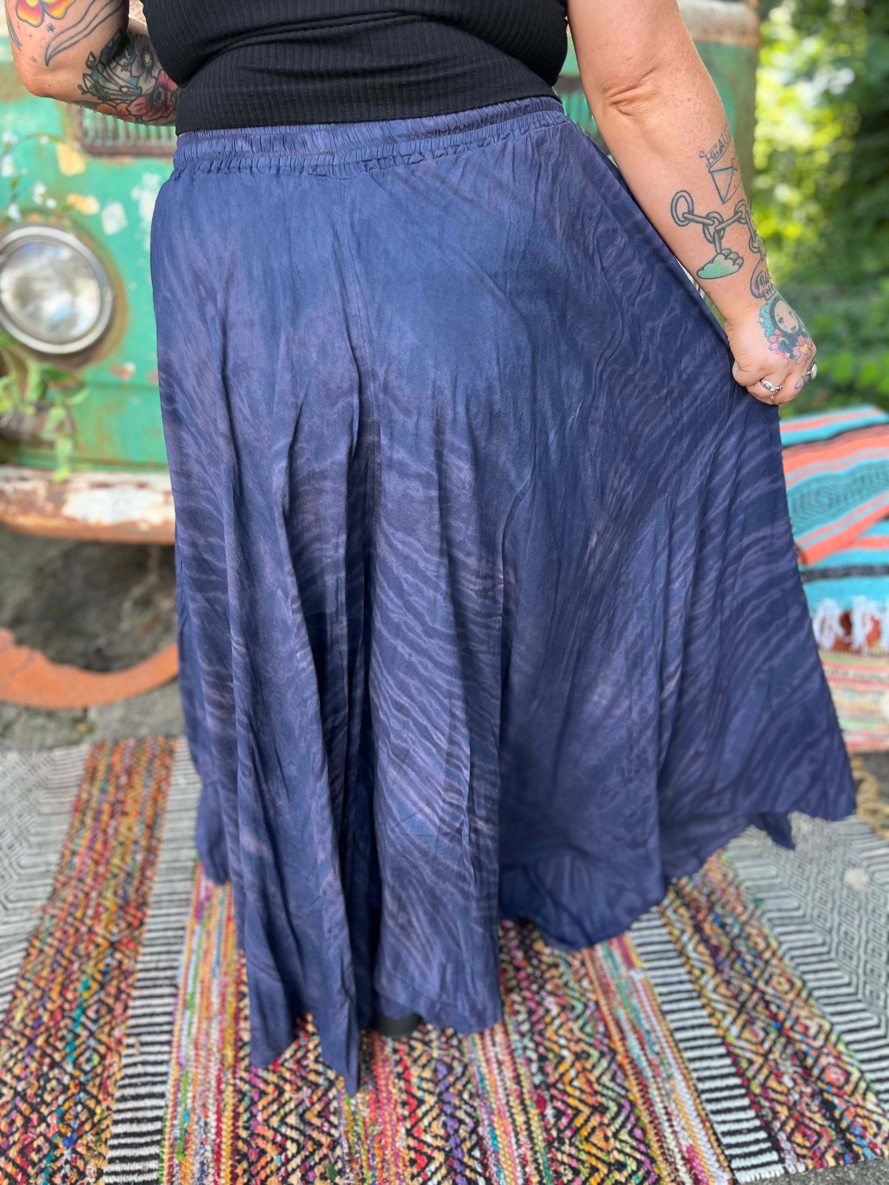 A woman wearing the navy Hippie Bohemian Hand Dyed Palazzo Pants in front of a vintage Volkswagen bus.