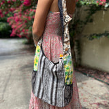 Someone wearing the Cotton Hemp Peace Sing Mushroom Shoulder Bag.