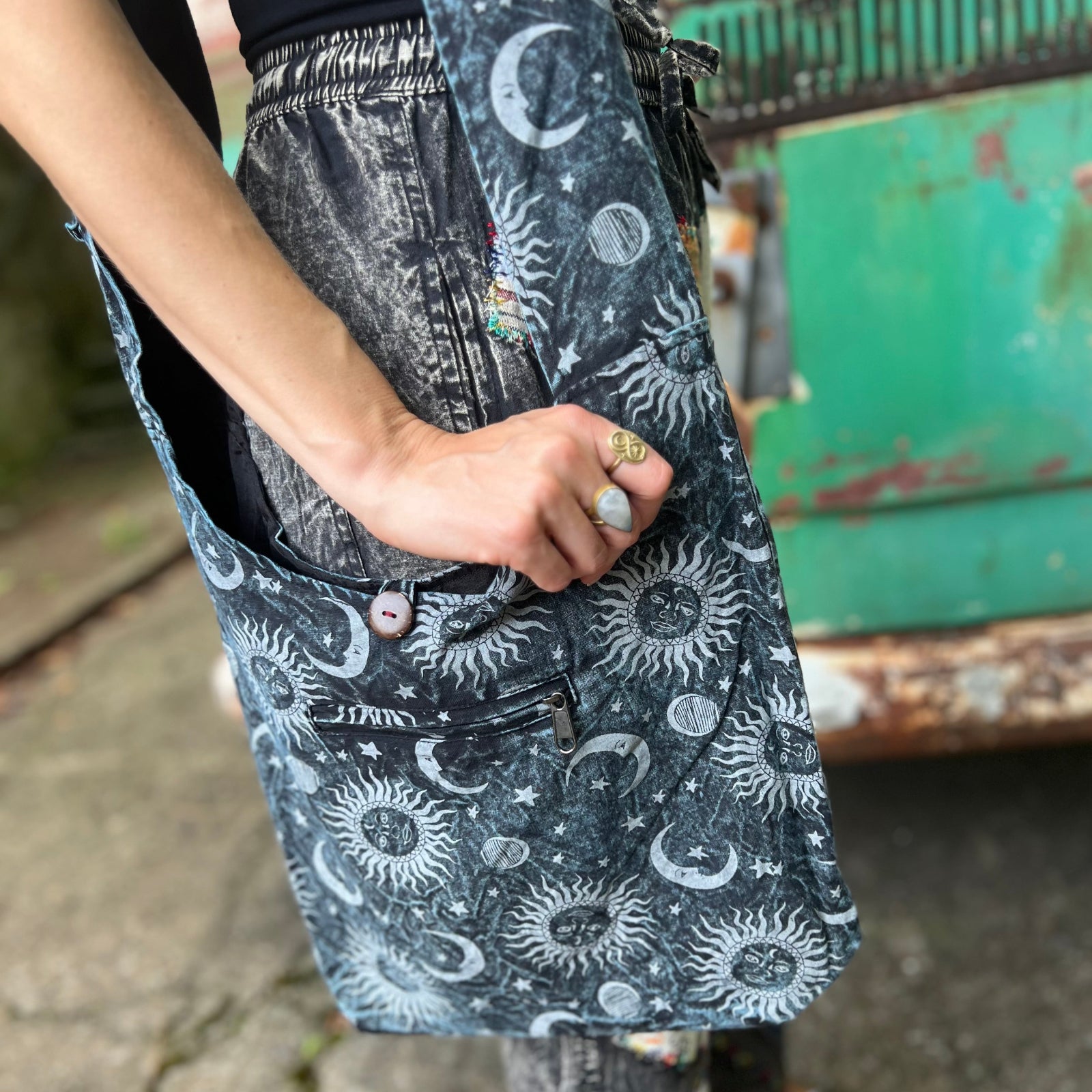 Someone wearing the Cotton Sun Moon Crossbody Bag in front of vintage Volkswagen bus.